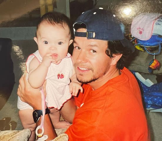 Mark Wahlberg Instagram Mark Wahlberg holding his daughter Ella Rae Wahlberg as an infant
