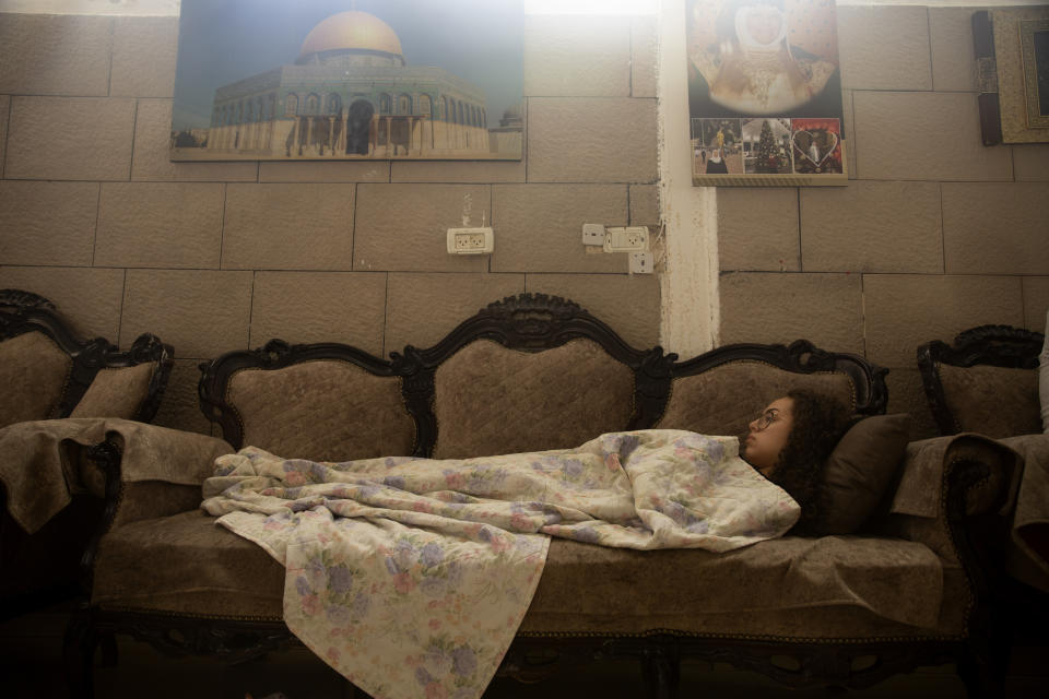 Palestinian teen Jana Kiswani recovers in her family home after being hit by a rubber coated bullet fired by Israeli police in the Sheikh Jarrah neighborhood of east Jerusalem, where her family is threatened with eviction from their home by Israeli settlers, Wednesday, May 26, 2021. (AP Photo/Maya Alleruzzo)