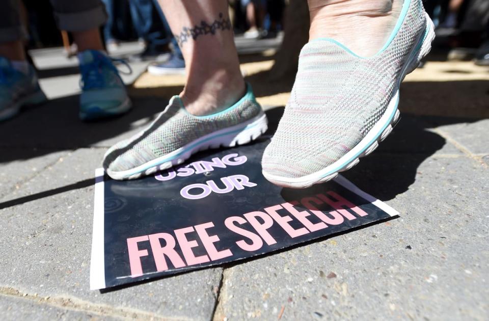 <div class="inline-image__caption"><p>A woman stomps on a free speech sign after conservative commentator Milo Yiannopoulos spoke to a crowd of supporters on the University of California, Berkeley campus on September 24, 2017.</p></div> <div class="inline-image__credit">Josh Edelson/AFP via Getty Images</div>