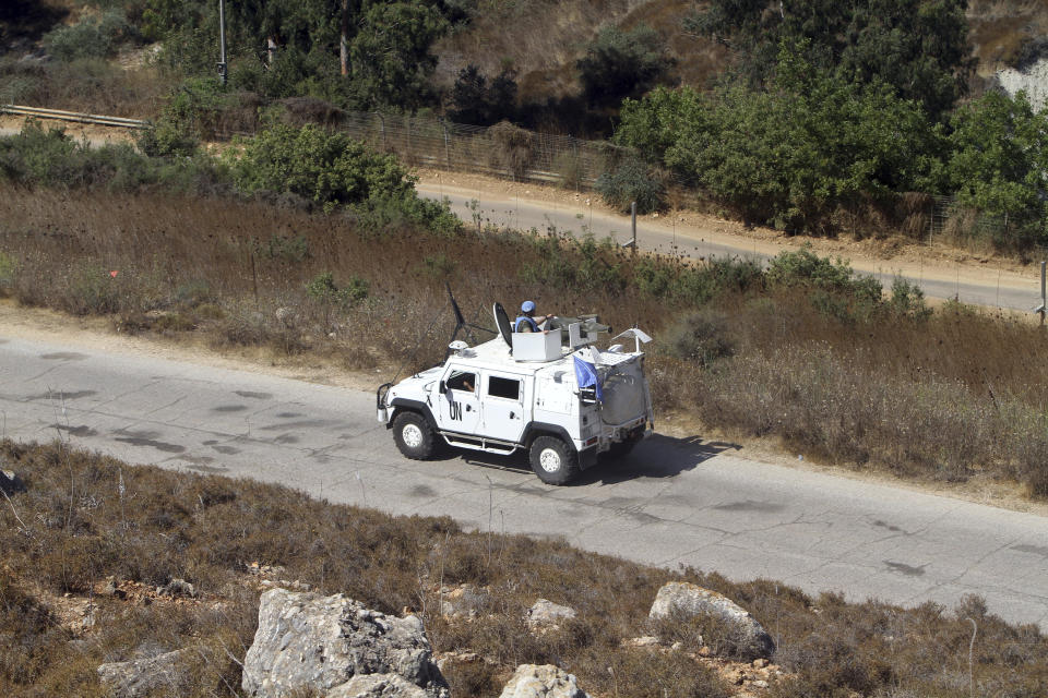 Spanish U.N peacekeepers patrol the Lebanese side of the Lebanese-Israeli border in the southern village of Kfar Kila, Lebanon, Monday, Aug. 26, 2019. Lebanon's state-run National News Agency said Monday that Israel's air force attacked a Palestinian base in the country's east near the border with Syria. Lebanese President Michel Aoun told the U.N. Special Coordinator for Lebanon, Jan Kubis, that the attacks violate a U.N. Security Council resolution that ended the 2006 war between Israel and Hezbollah. (AP Photo/Mohammed Zaatari)