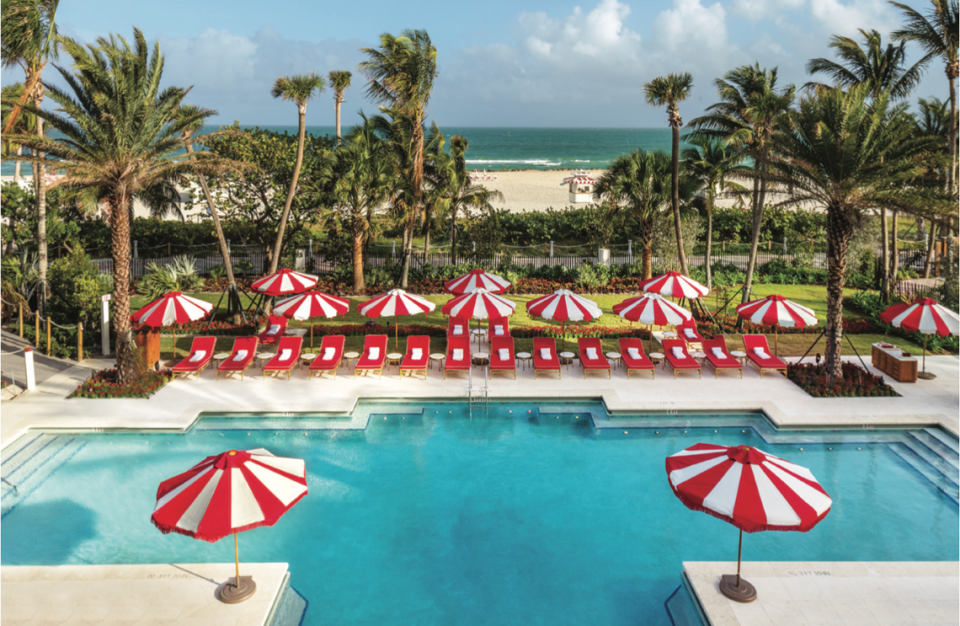 The instantly recognizable red and white umbrellas and turquoise pool at Faena Miami Beach. 