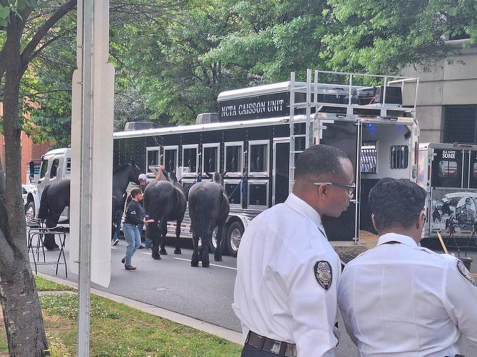 A caisson unit has arrived outside CMPD headquarters for the processional for CMPD Officer Joshua Eyer.