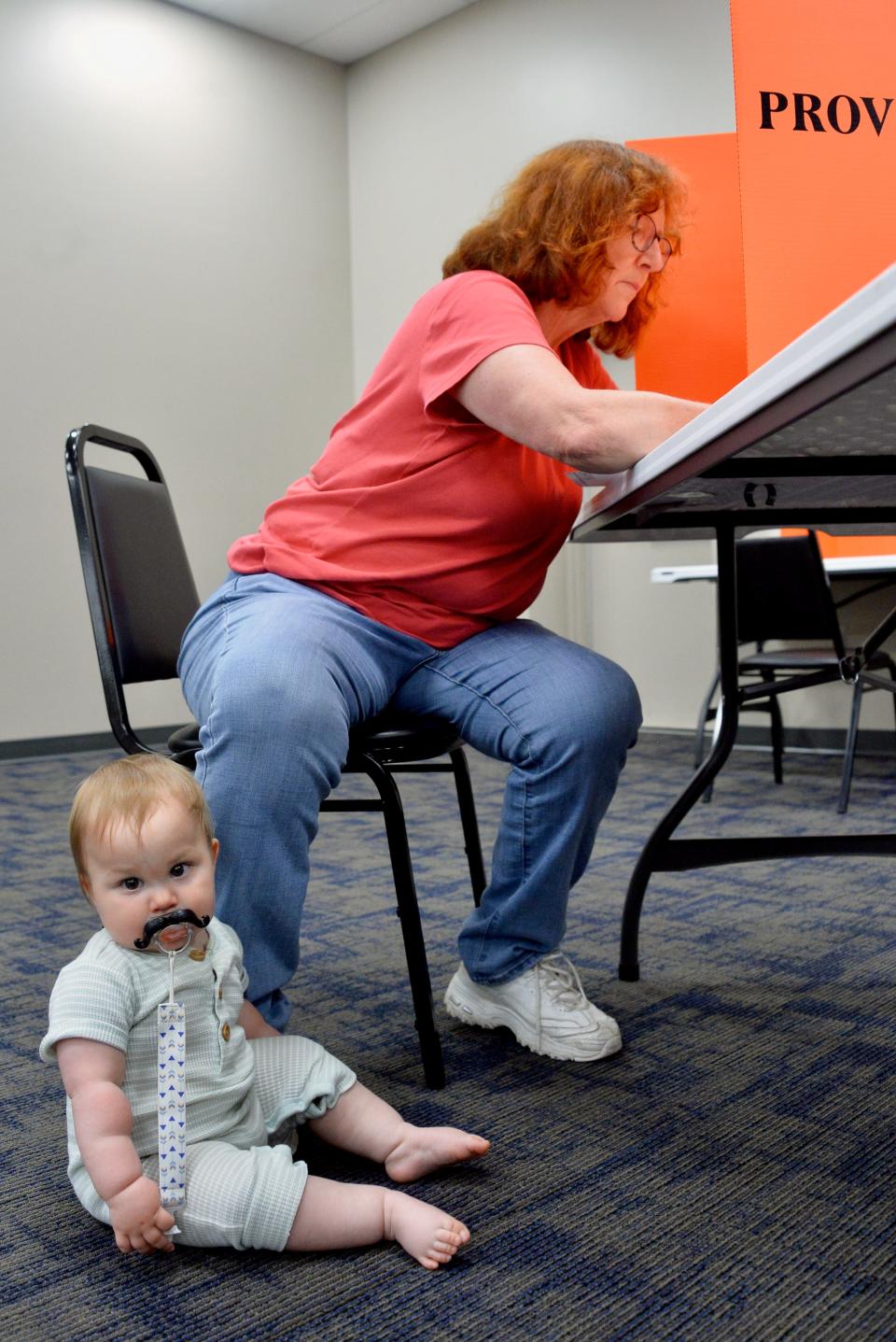 Teddy Tyler, 9 months, waits for his grandmother, Karen Ecker, as she fills out her provisional ballot for the Maryland primary at the Washington County Board of Elections headquarters on Tuesday morning. Ecker, who lives in the Hagerstown area, said she went to election headquarters to fill out a provisional ballot because she was babysitting nearby. She said she wants Teddy to learn how important it is to vote.