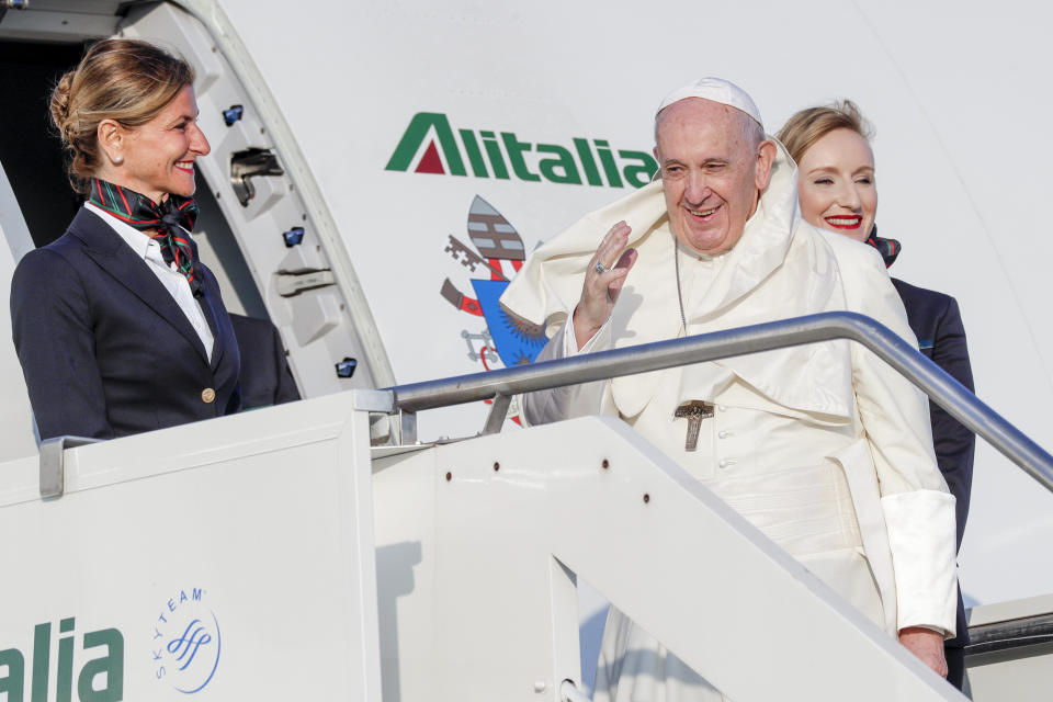 Pope Francis waves as he boards an aircraft on his way to Maputo, Mozambique, in Rome's Fiumicino International airport, Wednesday, Sept. 4, 2019. Pope Francis heads this week to the southern African nations of Mozambique, Madagascar and Mauritius, visiting some of the world's poorest countries in a region hard hit by some of his biggest concerns: conflict, corruption and climate change. (AP Photo/Andrew Medichini)