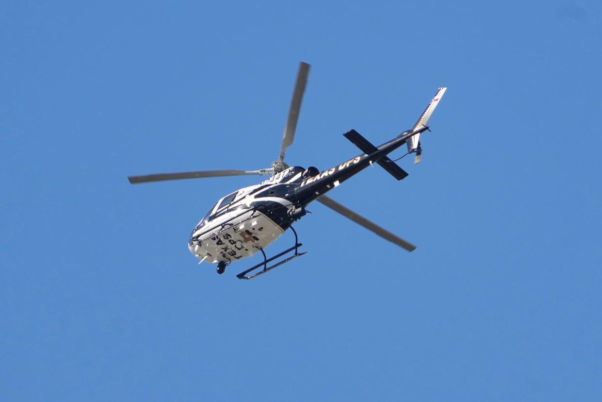 A Texas Department of Public Safety helicopter flies over Central Texas in this file photo. A DPS Eurocopter AS350 B2 crashed Thursday in South Texas.