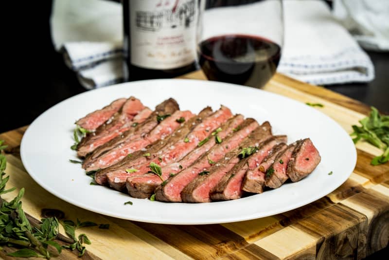 Stanley Tucci's steak recipe sliced on plate