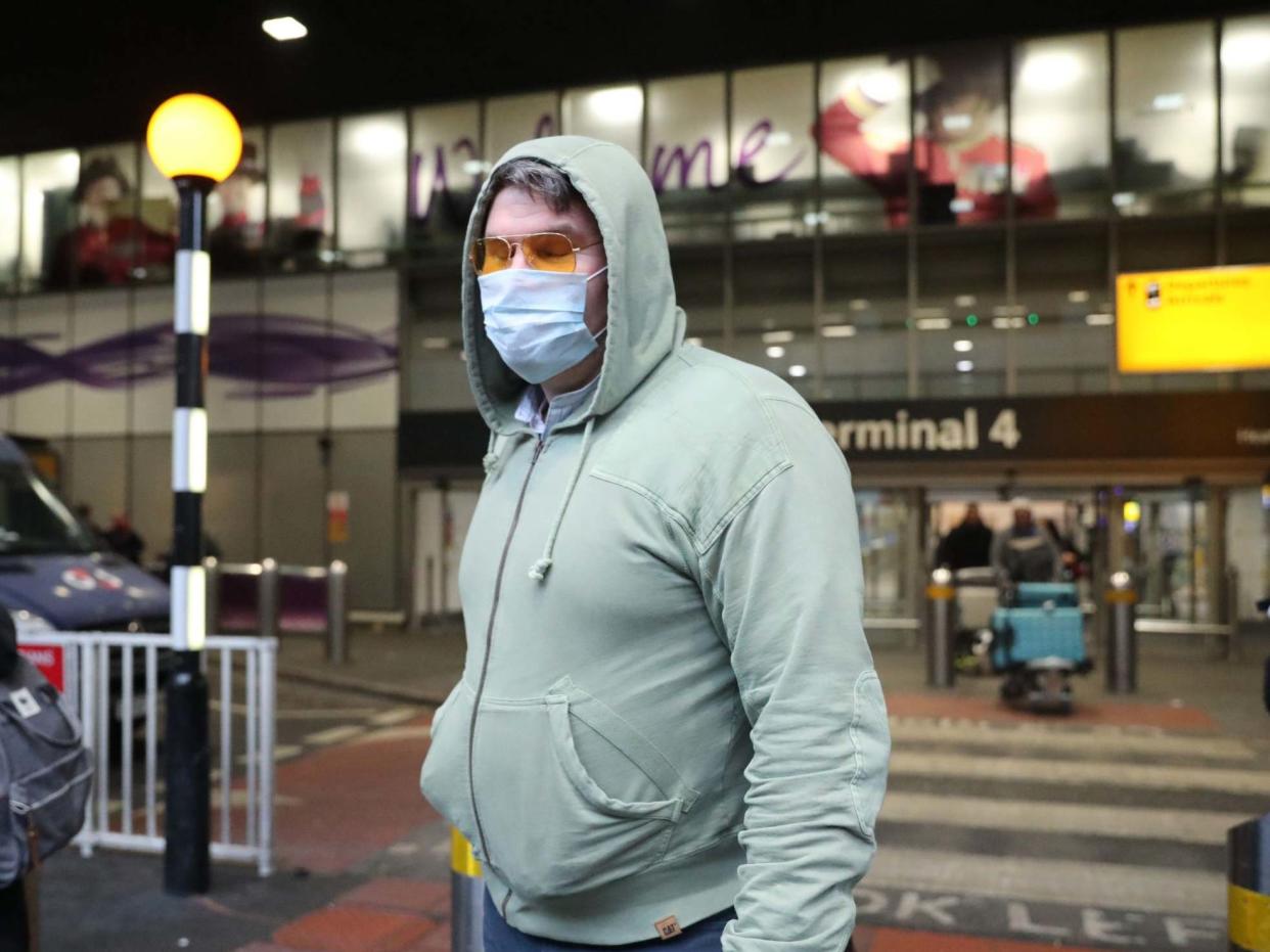 Passengers outside Heathrow Terminal 4, London, as the government met to discuss the threat from coronavirus: PA