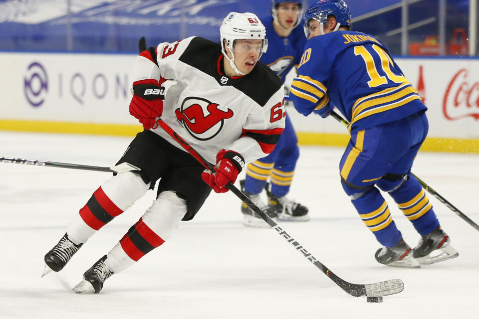 New Jersey Devils forward Jesper Bratt (63) skates with the puck during the first period of an NHL hockey game against the Buffalo Sabres, Saturday, Jan. 30, 2021, in Buffalo, N.Y. (AP Photo/Jeffrey T. Barnes)