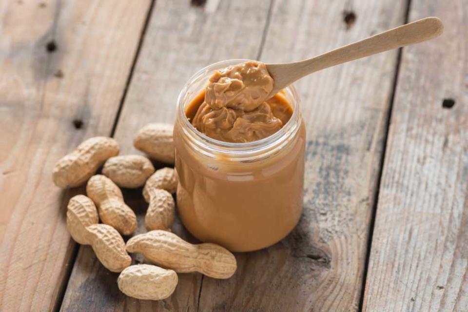 “Peanuts are naturally high in heart-healthy fat! To make the peanut butter ‘reduced fat,’ the manufacturers dilute the product by adding fillers,” Smith says. Shutterstock / inewsfoto