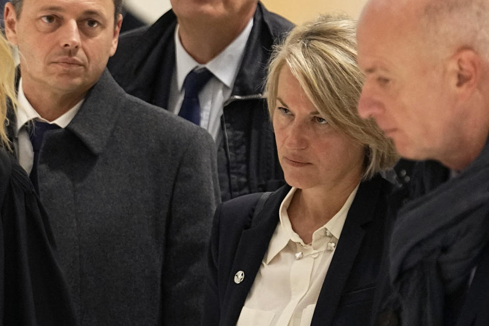 CEO of Air France Anne Rigail, center right, arrives to the trial of Airbus and Air France companies, at the Paris courthouse, in Paris, Monday, Oct. 10 , 2022. Airbus and Air France go on trial on manslaughter charges Monday over the crash of a Rio-Paris flight in 2009 that plunged into the Atlantic amid thunderstorms. The accident kiled all 228 people aboard and led to changes in air safety regulations. (AP Photo/Michel Euler)