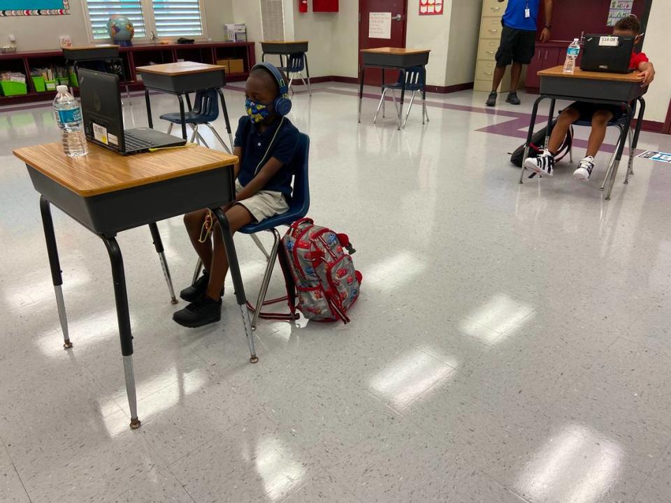 Broward Estates Elementary School students sit at desks that are spaced apart during their first day back to face-to-face learning Friday, Oct. 9, 2020.