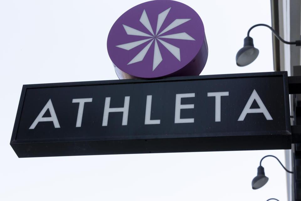 File-This Sept. 20, 2018, file photo shows the Athleta clothing logo is seen at a store in Pasadena, Calif. Simone Biles’ sponsors including Athleta and Visa are lauding her decision to put her mental health first and withdraw from the gymnastics team competition during the Olympics. It’s the latest example of sponsors praising athletes who are increasingly open about mental health issues. (AP Photo/Damian Dovarganes, File)