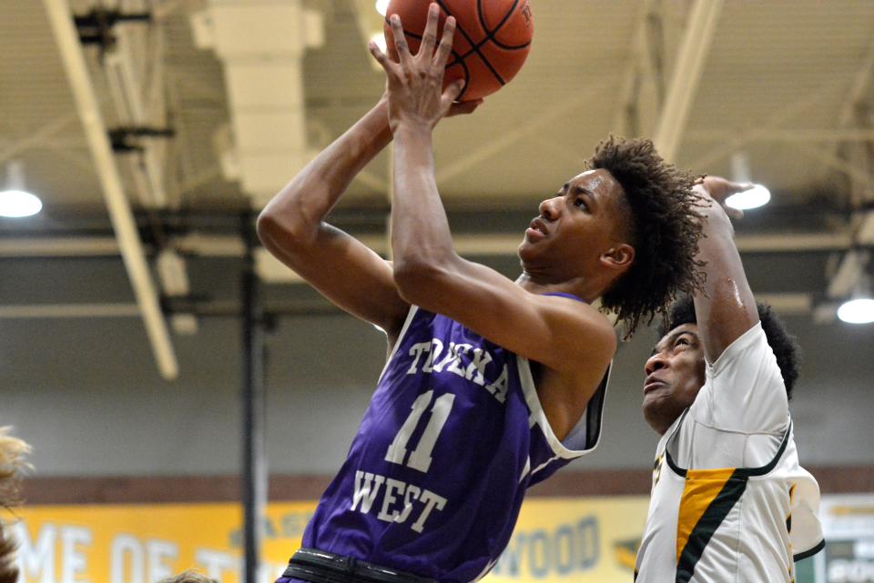 Keimani Paul saw the floor early for Topeka West against Basehor Linwood. The lanky freshman forward will try to carve out a role for himself this season