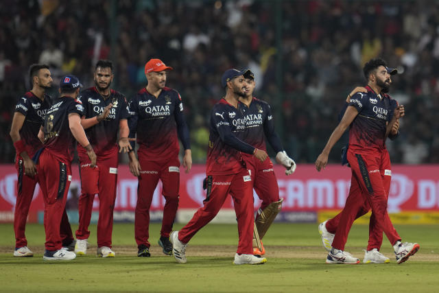 Royal Challengers Bangalore's players celebrate the wicket of Gujarat Titans' David Miller during the Indian Premier League cricket match between Royal Challengers Bangalore and Gujarat Titans in Bengaluru, India, Sunday, May 21, 2023. (AP Photo /Aijaz Rahi)