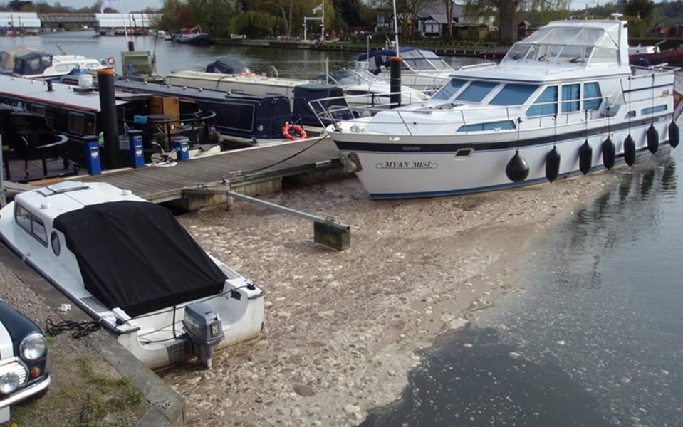 Sewage foam collecting around boats at Bourne End Marina - Credit: Environment Agency/PA