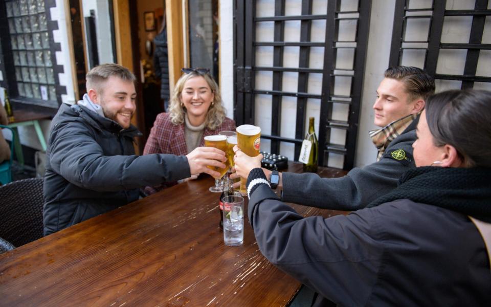 Drinkers on Glasgow's Ashton Lane in October - on the last day pubs in the city were allowed to serve alcohol - Wattie Cheung