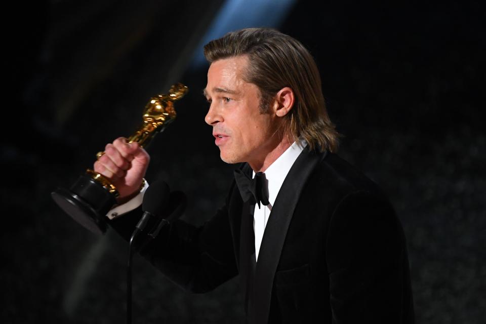 Brad Pitt accepts the award for best performance by an actor in a supporting role for "Once Upon a Time in Hollywood."