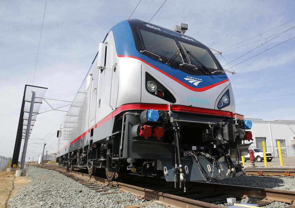 In this photo taken Saturday, May 11, 2013, is one of the new Amtrak Cities Sprinter Locomotives built by Siemens Rails Systems in Sacramento, Calif. The new electric locomotive, one of three of 70 to be built, will run on the Northeast intercity rail lines and replace Amtrak locomotives that have been in service for 20 to 30 years.(AP Photo/Rich Pedroncelli)