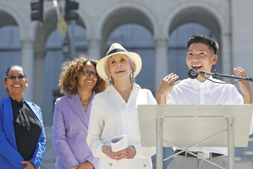 LOS ANGELES, CA - SEPTEMBER 1, 2022: Jane Fonda, center, holds a press conference to announce the Jane Fonda Climate PAC's endorsement of a slate of Los Angeles area candidates including Kenneth Mejia, right, who is running for Los Angeles City Controller, at Grand Park in downtown Los Angeles on Thursday, September 1, 2022. (Christina House / Los Angeles Times)