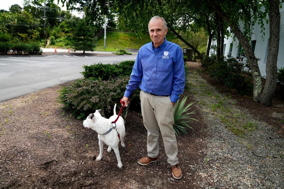 RISPCA President Wayne Kezirian with his rescue dog Lily earlier this year. The RISPCA temporarily closed its kennel to the public last week so the dogs could be checked for a canine respiratory illness that's been reported in 14 states.