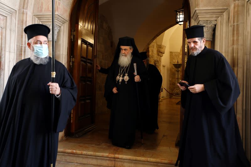 Greek Orthodox Patriarch of Jerusalem Theophilos III makes his way to The Holy Fire ceremony in the Church of the Holy Sepulchre in Jerusalem's Old City amid the coronavirus disease (COVID-19) outbreak