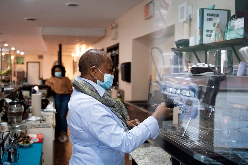 Owner Rose Marie Hicks makes a shot of espresso at Nuanced Cafe in Camden.