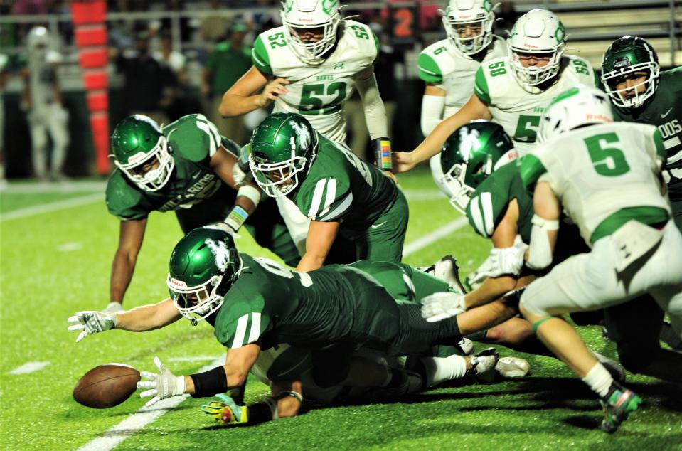Breckenridge's Anson Rodgers (9) pounces on a Wall fumble in last year's game at Breckenridge. Rodgers returns this year.
