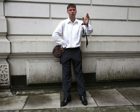 Lauri Love poses for media as he arrives for his extradition hearing at Westminster Magistrates' Court in London, Britain September 16, 2016. REUTERS/Peter Nicholls