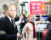 <p>A fake Donald Trump on a leash held by a fake Vladimir Putin and an “Emperor has no clothes” sign at a protest rally against Donald Trump outside the Lotte New York Palace Hotel in New York City. (Photo: Michael Brochstein/SOPA Images/LightRocket via Getty Images) </p>