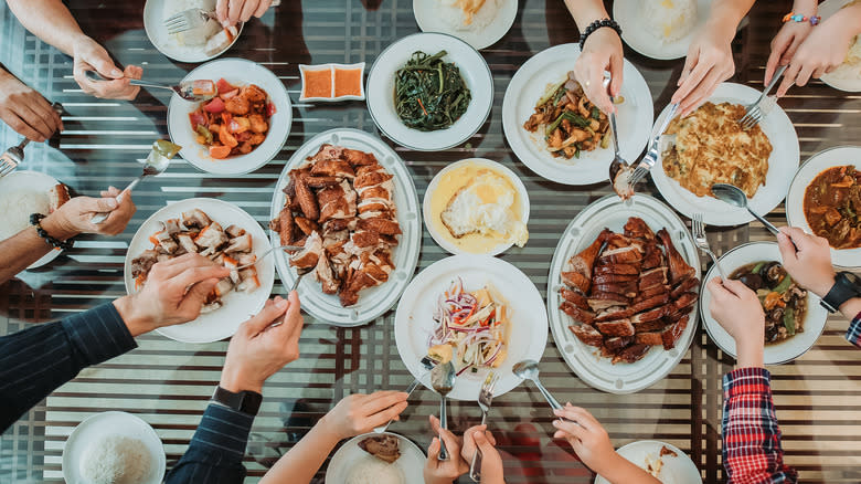 people sampling chinese food