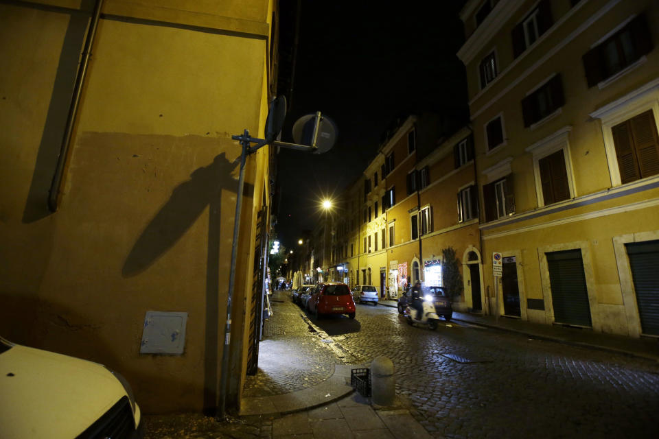 The wall, left, where the image depicting Pope Francis as Superman was posted, is seen empty at the Borgo Pio district near St. Peter's Square in Rome, Thursday, Jan. 30, 2014. Pope Francis’ status as a superhero has bit the dust. Rome’s decorum police early Thursday scrubbed the wall near the Vatican where “SuperPope” had been displayed, showing Francis as Superman in flight and clutching his black satchel of values to spread to the world. Artist Mauro Pallotta had put the image up on Monday in homage to Francis. Pallotta’s agent, Margaret Porpiglia said Thursday the artist is now hoping to avoid a city fine but is considering making a street art piece depicting the “anti-hero” Rome Mayor Ignazio Marino. The white caped crusader pope, which was actually painted on paper and affixed to the wall with water-based glue, had drawn immense popular interest around the Borgo neighborhood of tiny cobble stoned streets near St. Peter’s Square. (AP Photo/Gregorio Borgia)