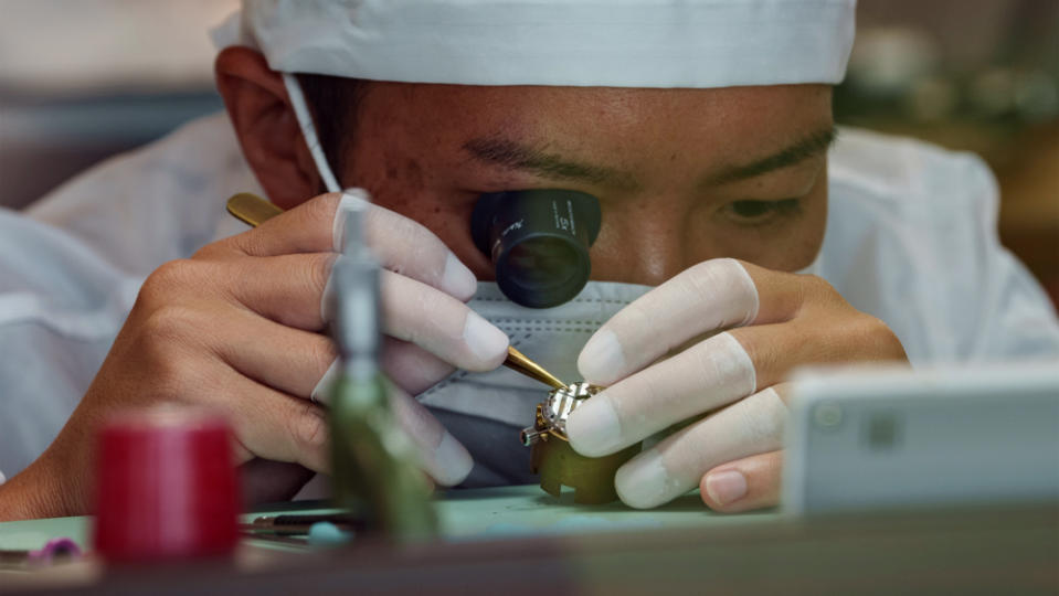 A watchmaker in Grand Seiko's Shizukuishi Manufacture assembles a movement