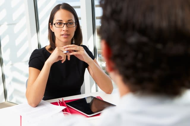 businesswoman interviewing male ...