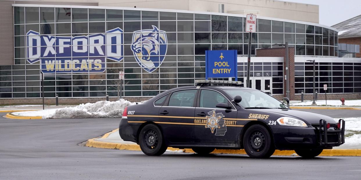 A police vehicle remains parked outside of Oxford High School on December 01, 2021 in Oxford, Michigan.