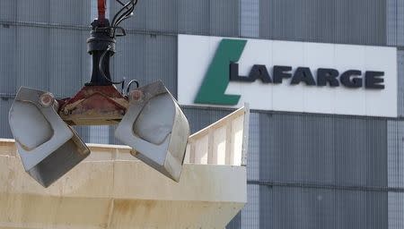 A logo is seen at a Lafarge concrete production plant in Pantin, outside Paris, April 7, 2014. REUTERS/Christian Hartmann