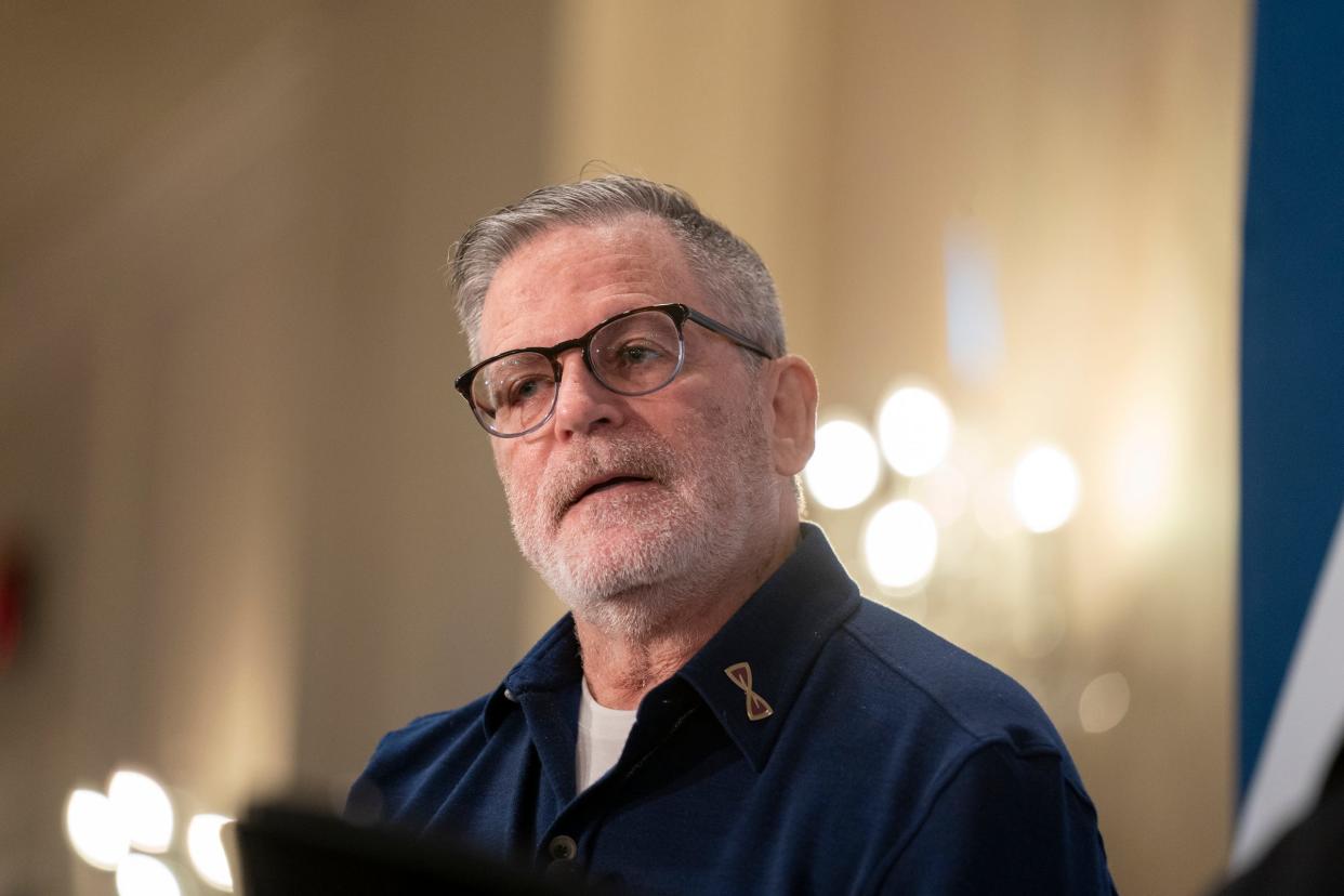 Dan Gilbert, president and chairman of Rocket Companies and philanthropist, is welcomed to the stage by Carol Cain as The Detroit Free Press Breakfast Club hosted Gilbert at the Townsend Hotel in Birmingham on Thursday, Nov. 30, 2023.