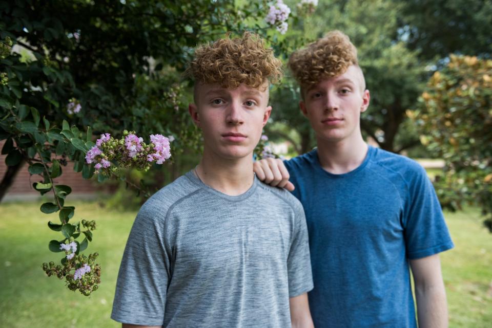 Twins Charlie, left, and Sam at their home in Texas. The brothers allege that celebrity cheerleader, Jerry Harris, solicited them for sex and sexually explicit photos. USA TODAY agreed to withhold their last name because the boys are minors and alleging abuse.