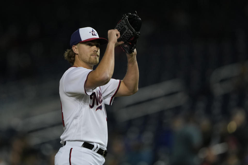 Washington Nationals starting pitcher Jake Irvin (74) gestures as he leaves the field during the fifth inning of a baseball game against the Chicago Cubs in Washington, Wednesday, May 3, 2023. (AP Photo/Manuel Balce Ceneta)