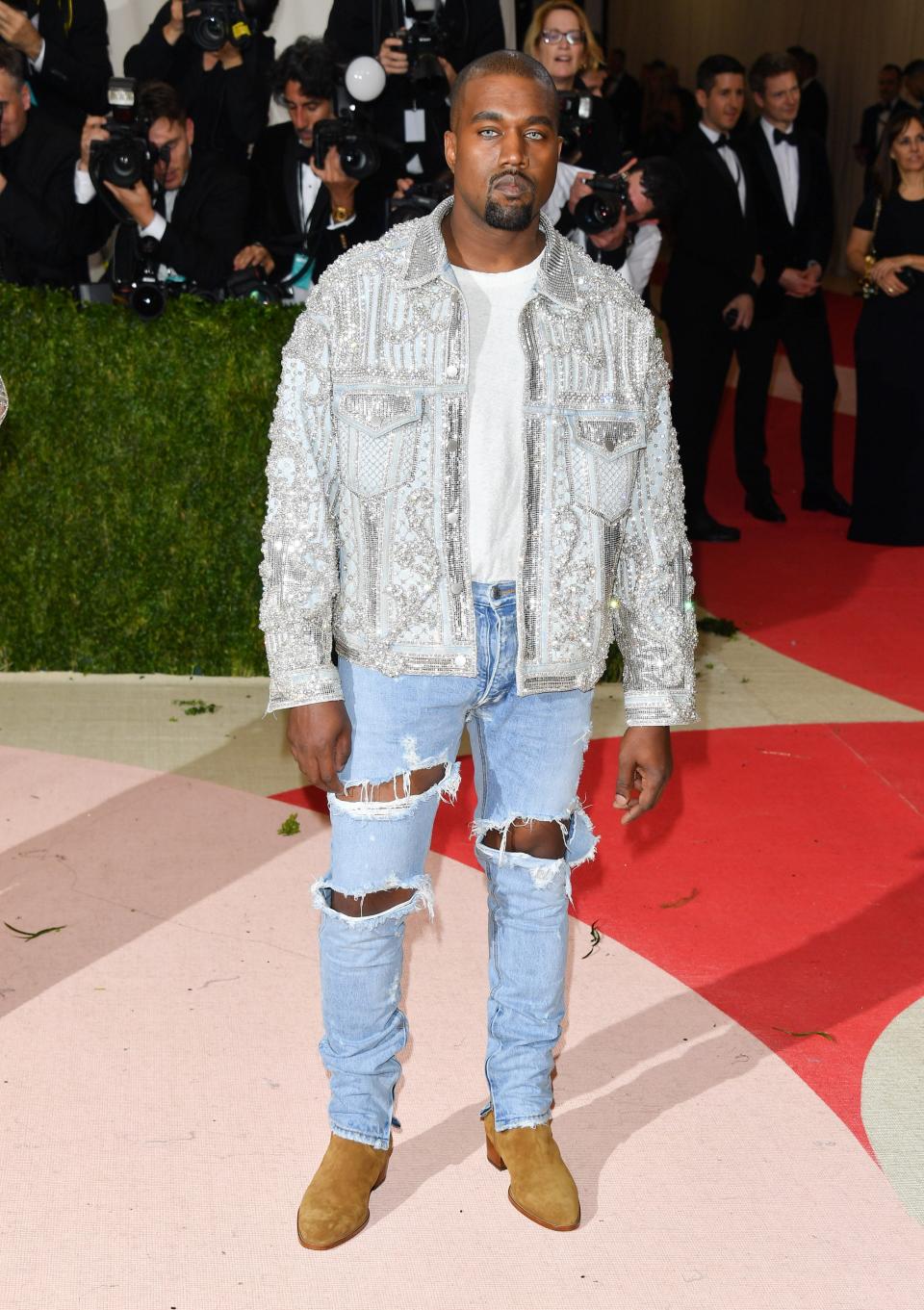 Not only did Kanye totally throw the dress code aside, wearing Fear of God jeans — and distressed ones at that! — on the red carpet, critics couldn't get over the fact that he used contacts to actually match the color of his eyes to his pants. (His jacket was from Balmain.)