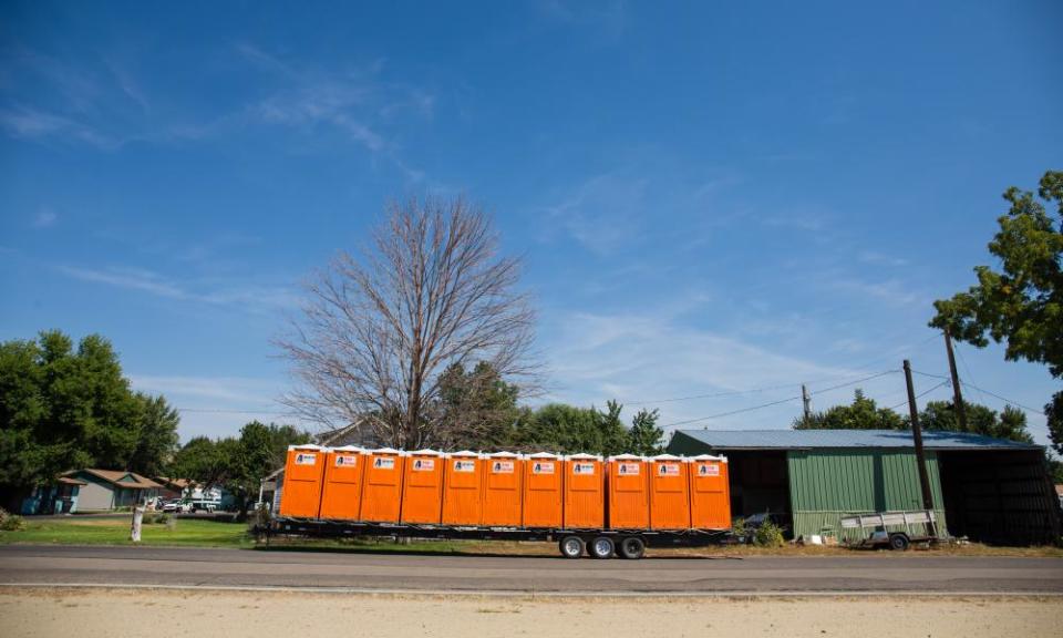 A trailer full of portable toilets waits to be unloaded in Weiser, Idaho. The rural town is preparing for crowds coming to see next week’s total eclipse.