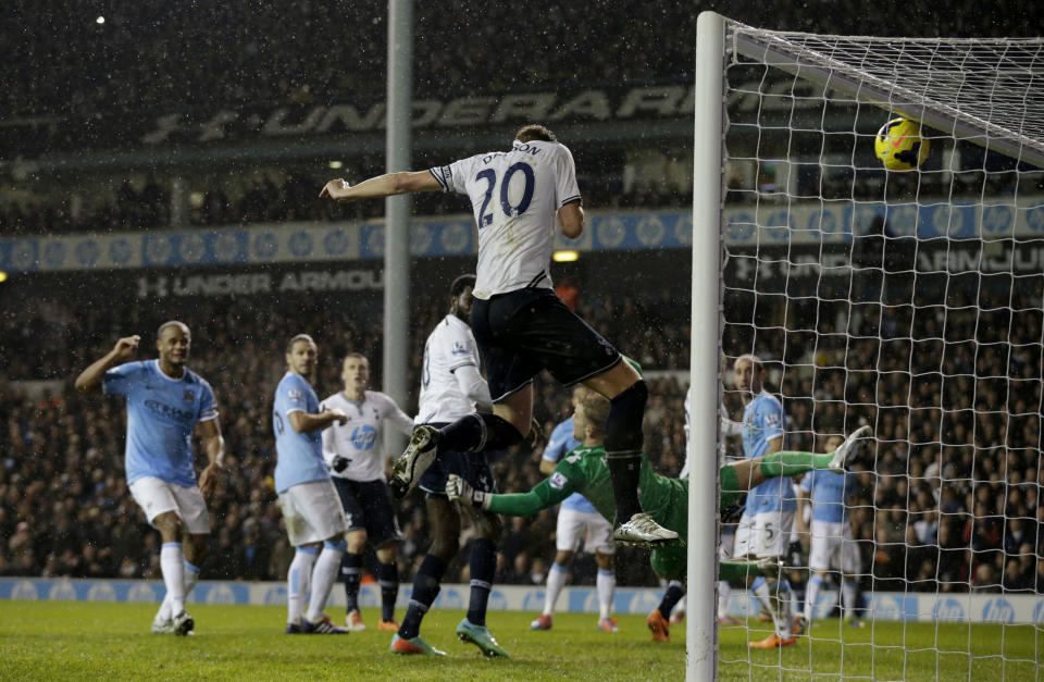 Tottenham Hotspur's Michael Dawson, 20, scores a goal that was judged to be offside and not given during the English Premier League soccer match between Tottenham Hotspur and Manchester City at White Hart Lane stadium in London, Wednesday, Jan. 29, 2014. (AP Photo/Matt Dunham)