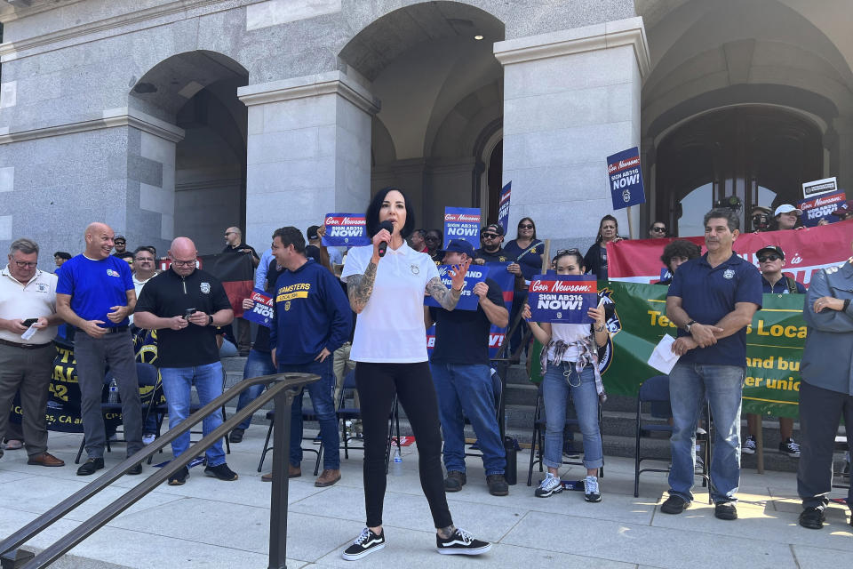 California union leaders, truck drivers and lawmakers rally outside the state Capitol in Sacramento, Calif., Tuesday, Sept. 19, 2023. They are demanding that Democratic Gov. Gavin Newsom sign a bill that would require self-driving semi-trucks to have a human present as they are tested on public roads for their safety. (AP Photo/Sophie Austin)