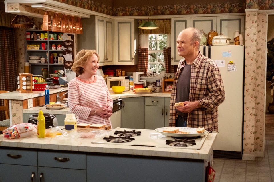 Red and Kitty smiling in the kitchen