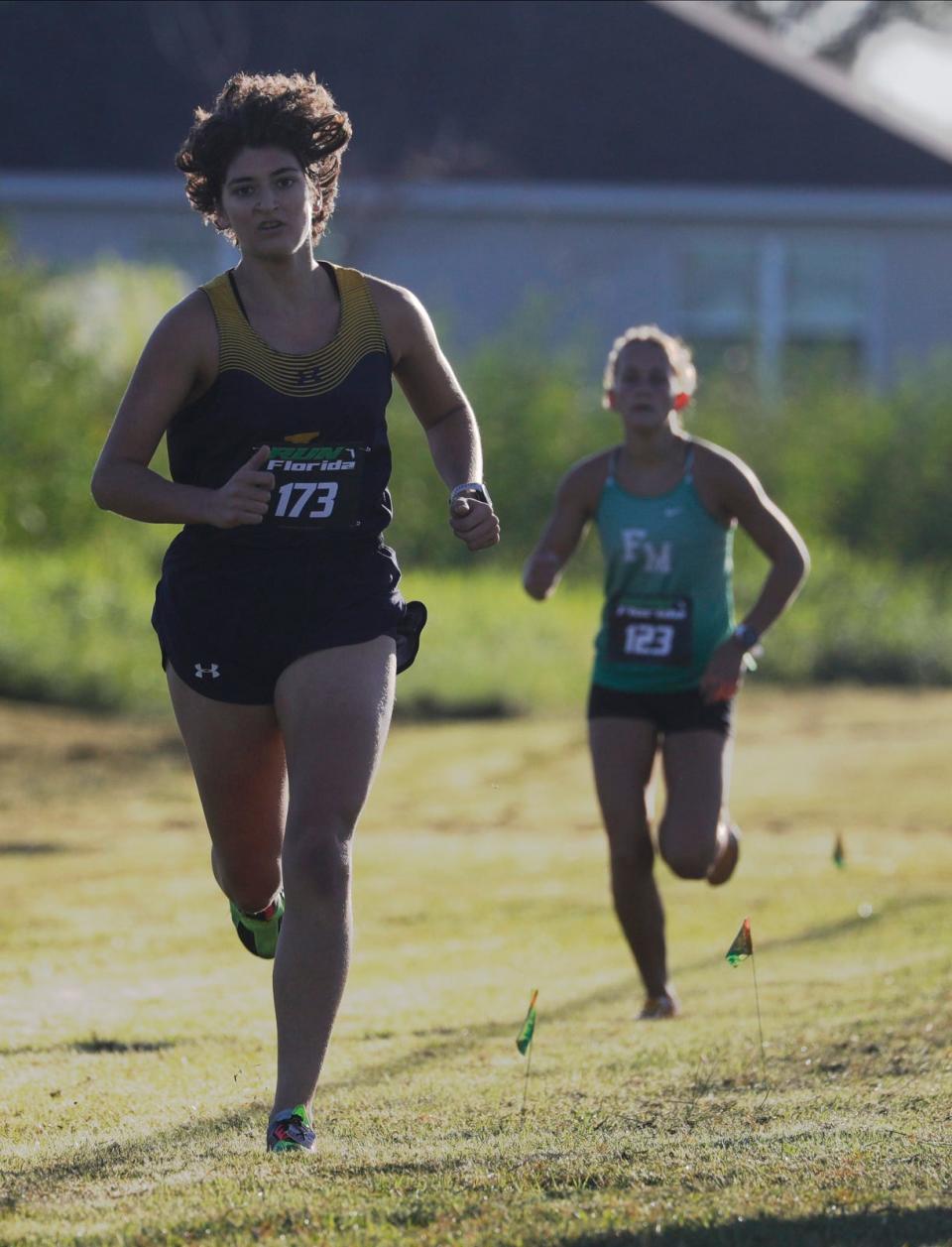 Gianna Del Pizzo, 17, from Lehigh Senior High School, makes her way through the course at the Cape Coral Sports Complex Thursday morning October, 19, 2023, where the Lee County Athletic Conference (LCAC) Cross Country championships were held. She was the girls individual winner.