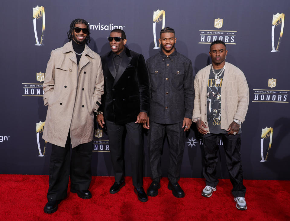deion sanders and sons on red carpet of NFL Honors event