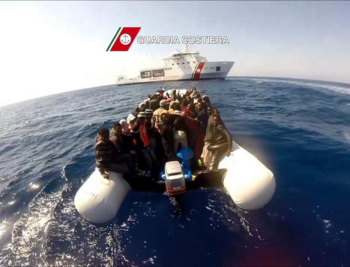 In this video grab released by the Italian Guardia Costiera on April 17, 2015 migrants sit in a boat during a rescue operation on April 15 off the coast of Sicily as part of the Triton plan (AFP Photo/)