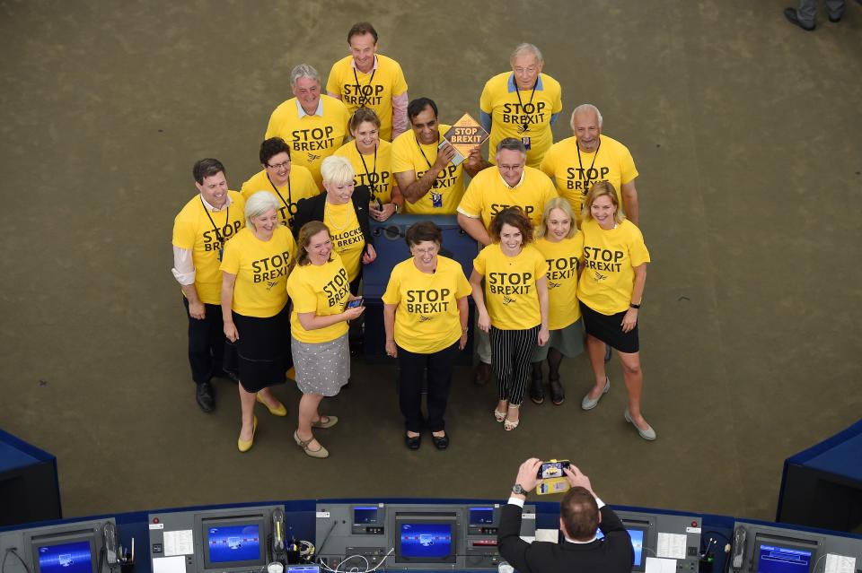 Newly elected MEPs, wearing t-shirts with an inscription against the Brexit, pose for a picture before the inaugural session at the European Parliament on July 2 , 2019 in Strasbourg, eastern France. - The 751-seat parliament is more fragmented than ever after a vote in May that saw solid gains by the liberals and Greens as well as the far right and eurosceptics. With Brexit delayed until as late as October 31, the deep political divisions in Britain were on full display in the eastern French city as 73 British MEPs arrived to parliament. (Photo by FREDERICK FLORIN / AFP)        (Photo credit should read FREDERICK FLORIN/AFP/Getty Images)