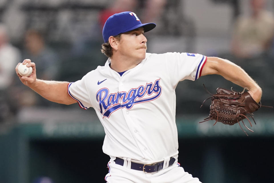 Texas Rangers starting pitcher Spencer Howard throws during the first inning of a baseball game against the Oakland Athletics in Arlington, Texas, Monday, July 11, 2022. (AP Photo/LM Otero)