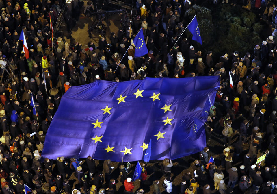 Several thousands demonstrators gather to demand the resignation of Czech Republic's Prime Minister Andrej Babis, at the Wenceslas square in Prague, Czech Republic, Tuesday, Dec. 10, 2019. Babis faces legations that he has misused EU subsidies for a farm he transferred to his family members, though he denies wrongdoing. (AP Photo/Petr David Josek)