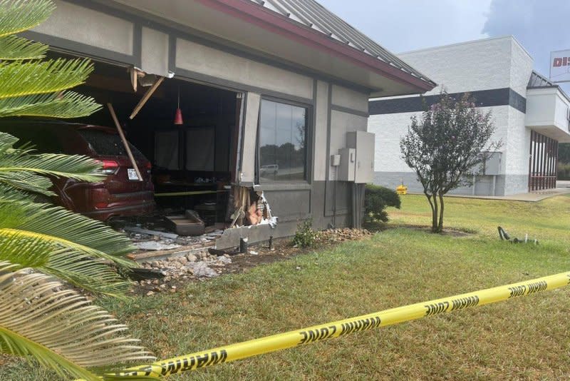A maroon SUV sits inside a damaged Denny's restaurant in Rosenberg, Texas, where 23 people were injured Monday. Police are investigating what caused the driver to crash into the building. Photo courtesy of Rosenberg Police Department
